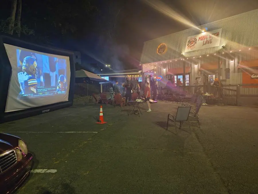 Game night with guests watching the big outdoor screen at R & B Made With Love in Jasper, GA